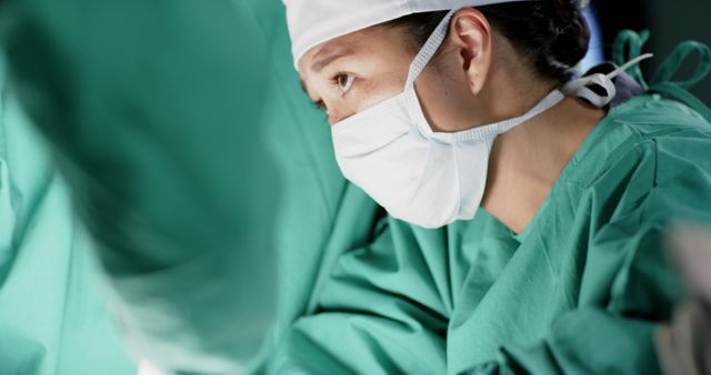 Focused Female Surgeon Performing Surgery in Operating Room - Download Free Stock Images Pikwizard.com