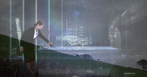 Businesswoman gesturing towards 3d architectural model on digital screen