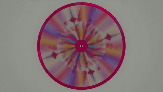 Abstract colorful geometric disc art with magenta frame