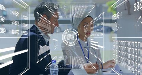 Colleagues Reviewing Documents with Digital Technology Overlay