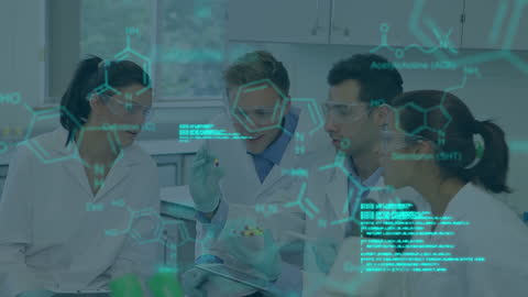 Researchers Analyzing Chemical Data in High-Tech Laboratory