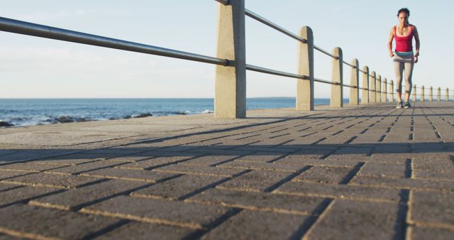 Woman Jogging on Seaside Boardwalk in Morning - Download Free Stock Images Pikwizard.com