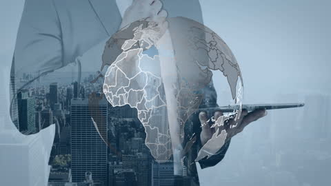 Businessman with Digital Globe and Cityscape Overlay Using Tablet