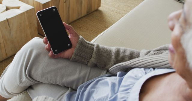 Senior Woman Relaxing at Home Using Smartphone - Download Free Stock Images Pikwizard.com