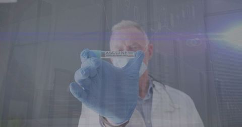 Doctor Displaying COVID-19 Vaccine Against Technology Overlay