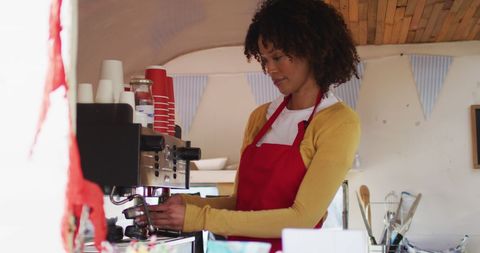 Woman Preparing Coffee in Mobile Food Truck Entrepreneur