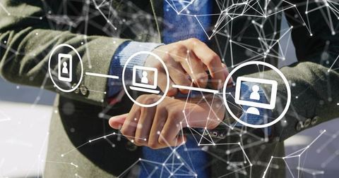 Businessman checking smartwatch while controlling smartphone with network connection icons