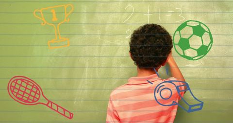 Boy Writing on Blackboard with Sports Icons Overlay