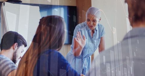 Diverse Team Engaging in Financial Data Analysis Meeting