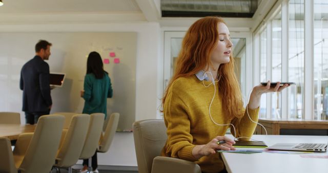 Young Businesswoman Using Voice Assistant in Modern Office - Download Free Stock Images Pikwizard.com