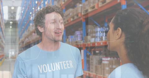 Volunteers Discussing Logistics in Warehouse with Data Overlay - Download Free Stock Images Pikwizard.com