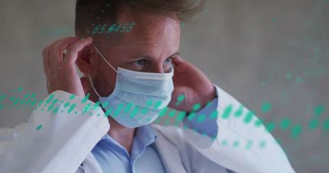 Clinician Securing Surgical Mask with Digital Data Overlay Representing Medical Technology