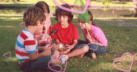 Curious kids exploring nature with insect jar and net