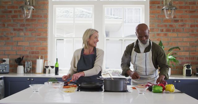 Smiling Biracial Senior Couple Cooking Together in Home Kitchen - Download Free Stock Images Pikwizard.com