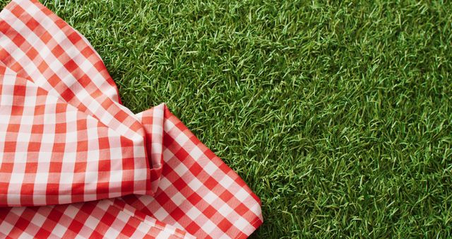 Close up of red and white checkered blanket on grass with copy space - Download Free Stock Photos Pikwizard.com