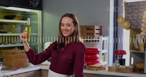 Artisan Food Shop Assistant Displaying Wine Bottle