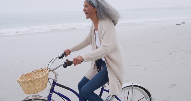 Elderly Woman Enjoying Beach Bike Ride - Download Free Stock Images Pikwizard.com