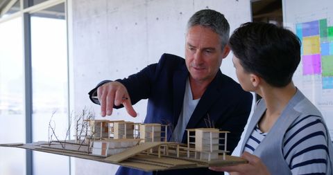 Architects Collaborating on Innovative Factory Model Design