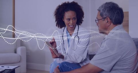 Doctor Conversing with Patient in Modern Healthcare Environment