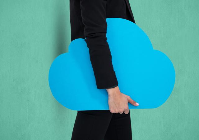 Midsection of businesswoman holding cloud shape - Download Free Stock Photos Pikwizard.com