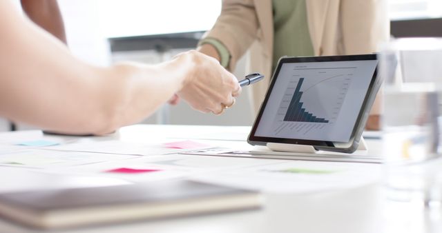 Business Professionals Reviewing Financial Data on Tablet in Office - Download Free Stock Images Pikwizard.com