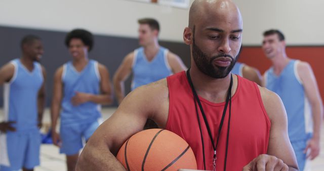 Coach Holding Basketball During Team Practice - Download Free Stock Images Pikwizard.com