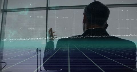 Businessman Analyzing Financial Data in Airport Terminal