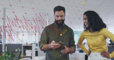 Business colleagues analyzing innovative data visualizations