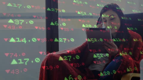 Woman Analyzing Stock Market Data on Tablet at Home