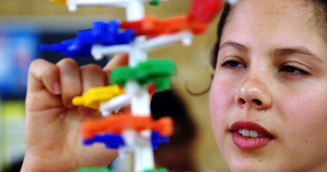 Focused Child Observing Colorful Educational Toy in Class - Download Free Stock Images Pikwizard.com