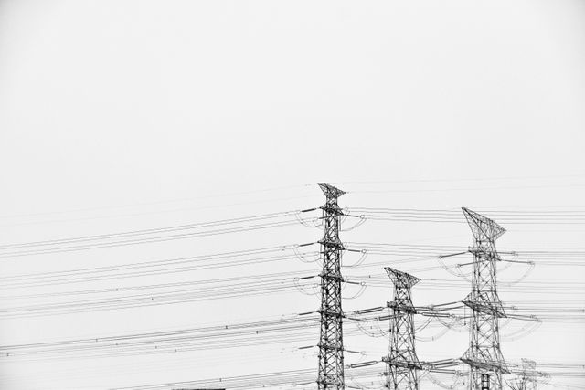 High Voltage Electrical Transmission Towers with Clear Sky - Download Free Stock Photos Pikwizard.com