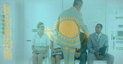 Executive greeting candidates during corporate interview panel in modern glass office with kazakhsta