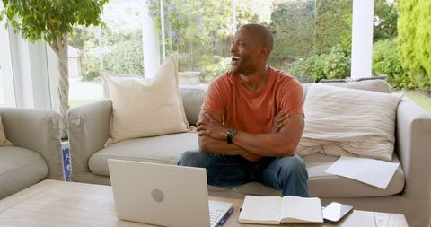 Joyful Man Enjoying Video Call in Modern Home Setting