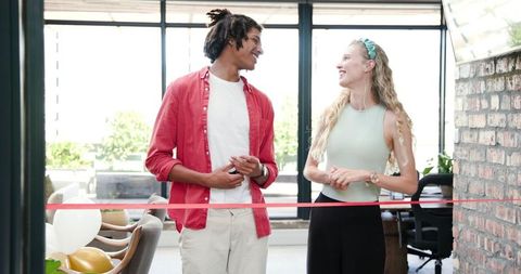 Diverse colleagues celebrating a grand opening together
