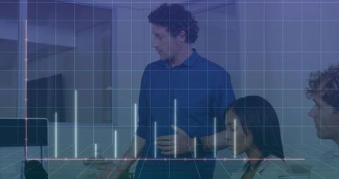 Professional Team Analyzing Data Visualization in Office