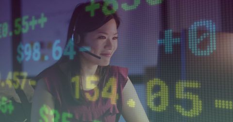 Businesswoman Analyzing Financial Data with Headset