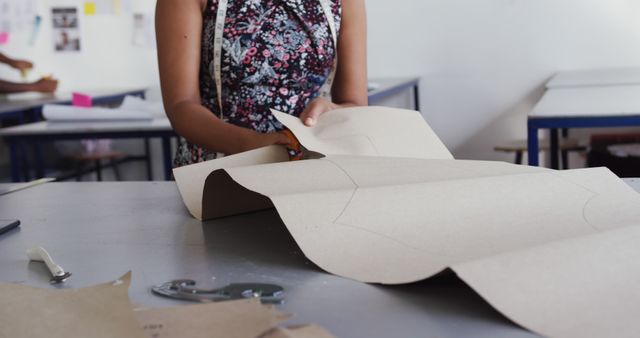 Seamstress Cutting Paper Patterns in Design Studio - Download Free Stock Images Pikwizard.com