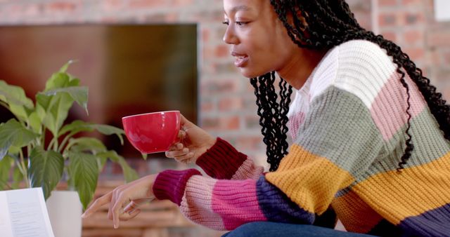 Young Woman Relaxing with Coffee and Reading at Home - Download Free Stock Images Pikwizard.com