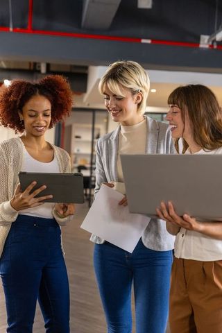 Diverse Businesswomen Collaborating in Modern Open-Plan Office