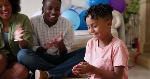 Family Celebrating Birthday Intimately at Home with Laughter