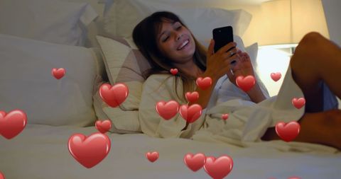 Woman Relaxing in Bed with Romantic Digital Hearts Animation
