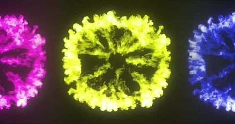 Vibrant colored powder bursts on black background