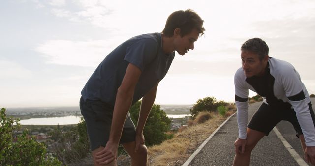 Father and Son Resting After Coastal Run at Sunset - Download Free Stock Images Pikwizard.com