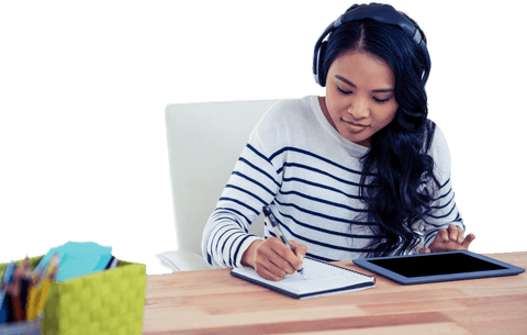 Transparent Efficient Asian Woman Writing with Headphones in Office - Download Free Stock Videos Pikwizard.com