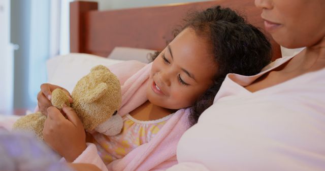 Mother and Daughter Bonding While Cuddling Teddy Bear in Bed - Download Free Stock Images Pikwizard.com