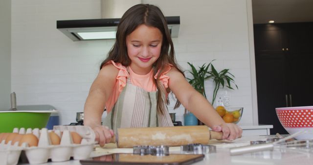 Young Girl Rolling Dough in Kitchen with Baking Ingredients - Download Free Stock Images Pikwizard.com