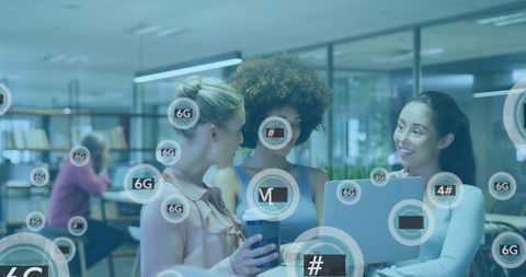 Diverse female team collaborating around laptop with 6g network overlay in modern workspace