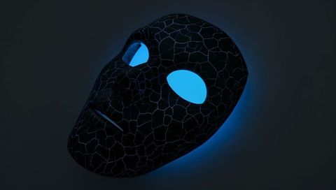 Cracked black mask glowing with cyan eye light, casting neon halo on dark textured wall