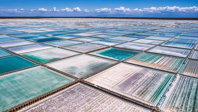 Aerial Salt Evaporation Ponds Forming Turquoise Geometric Grid on Vast Salt Flats