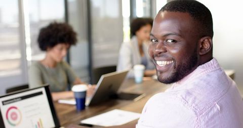 Smiling Diverse Team Collaborating in Modern Office